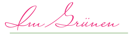Die Grafik zeigt den Schriftzug "Im Grünen".